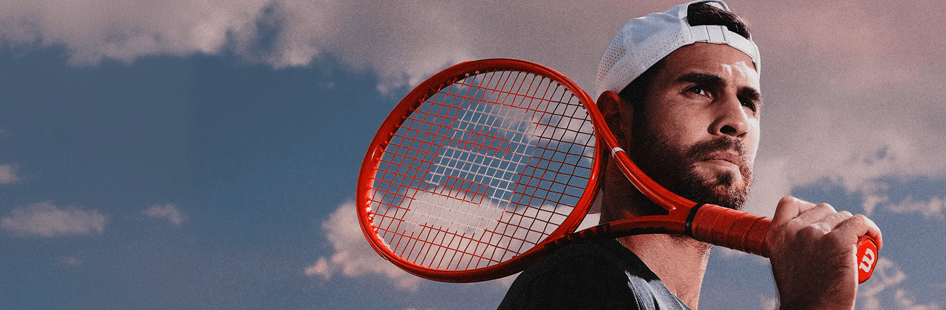 Player holding the Wilson Defyer 98 Pro tennis racquet